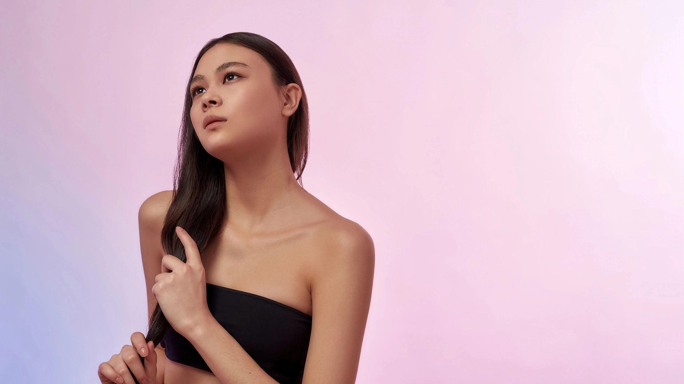 Beautiful Asian woman isolated on pink background