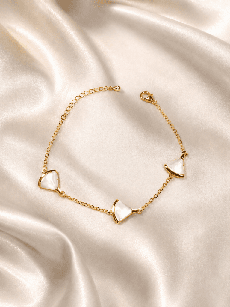 Gold-Tone Mother-of-Pearl Bracelet stacked with other bracelets